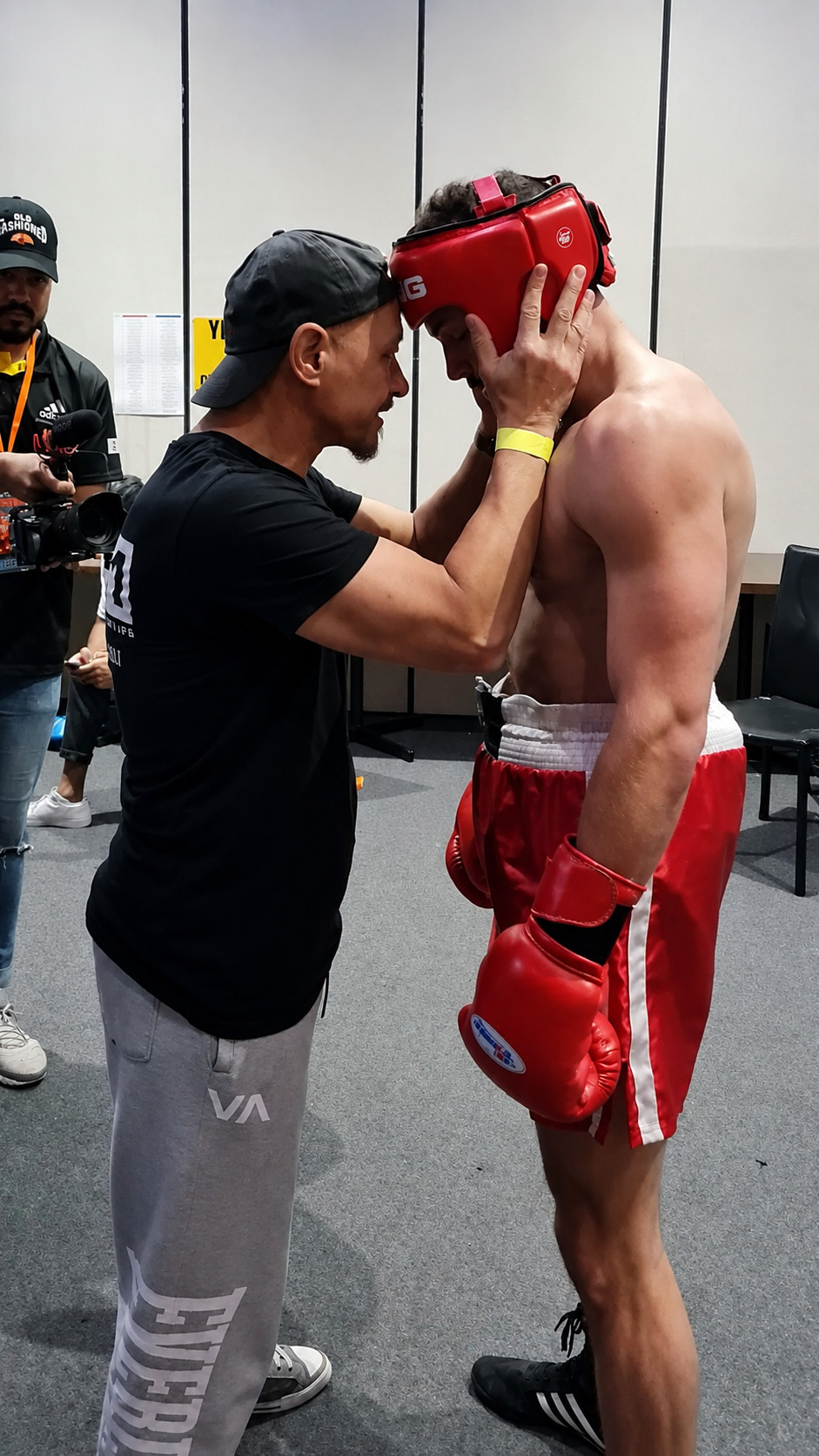 BX1 coach preparing a boxer immediately before competition