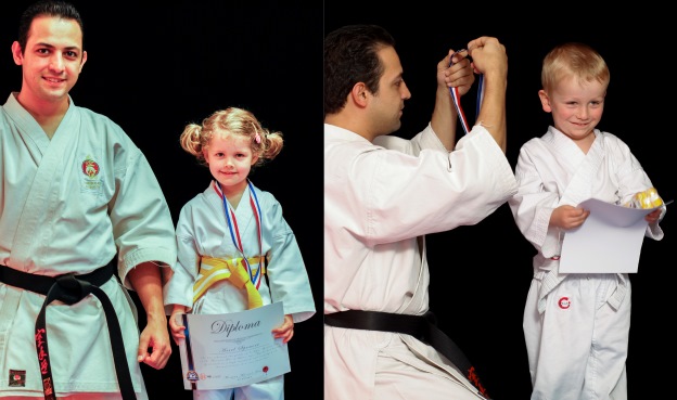 Two BX1 children being recognised by their karate instructors after completing a grading