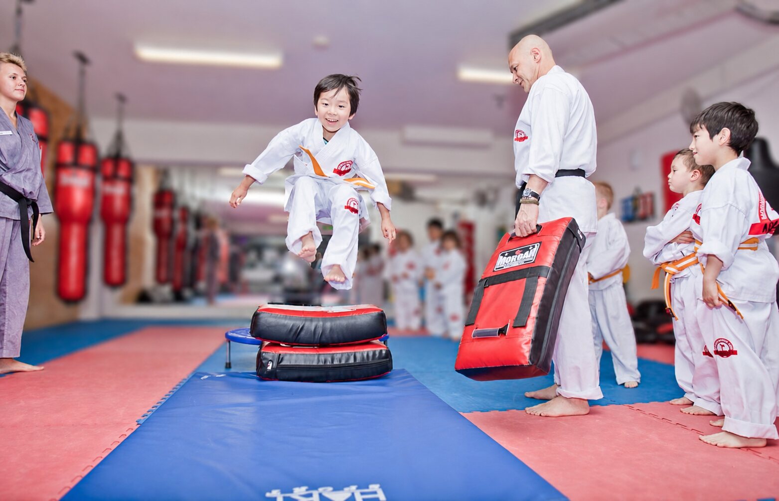 Child completing a supervised karate challenge during school holiday training at BX1 Neutral Bay